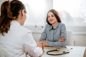 woman talking to doctor about her fibroids 